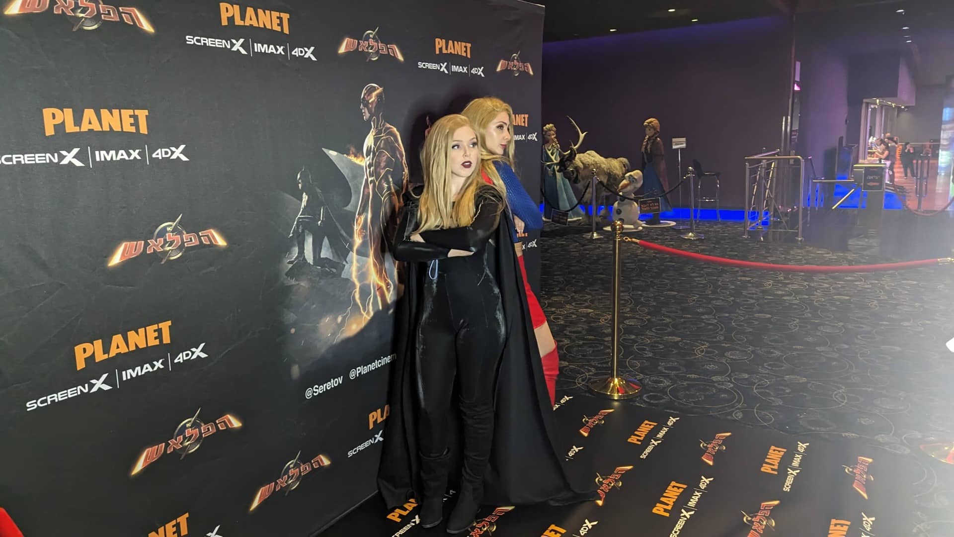 2 woman standing on the red carpet at the Flash premiere.
